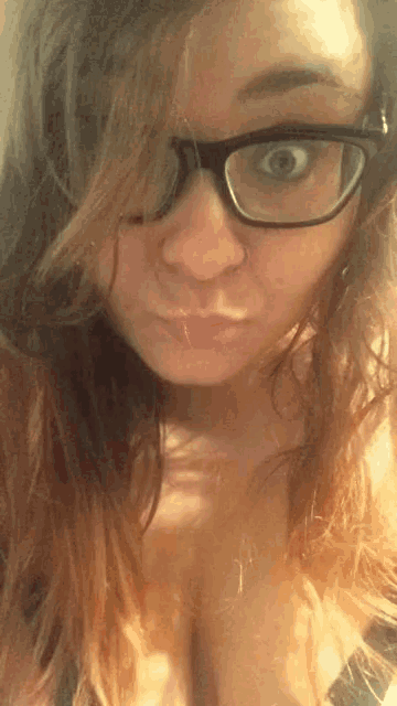 a close up of a woman wearing glasses
