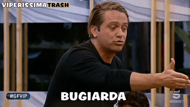 a man is making a funny face with the word bugiarda above him