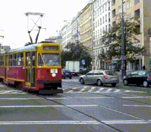 a red and yellow trolley with the number 18 on the front of it
