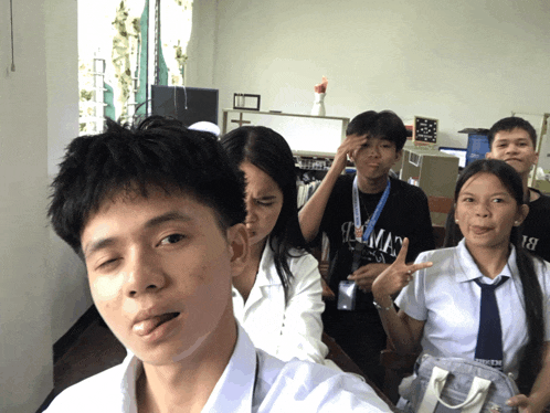 a boy with a lanyard around his neck that says ' i 'm a ' on it