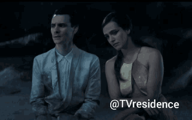 a man and a woman are sitting next to each other with the words @tvresidence behind them