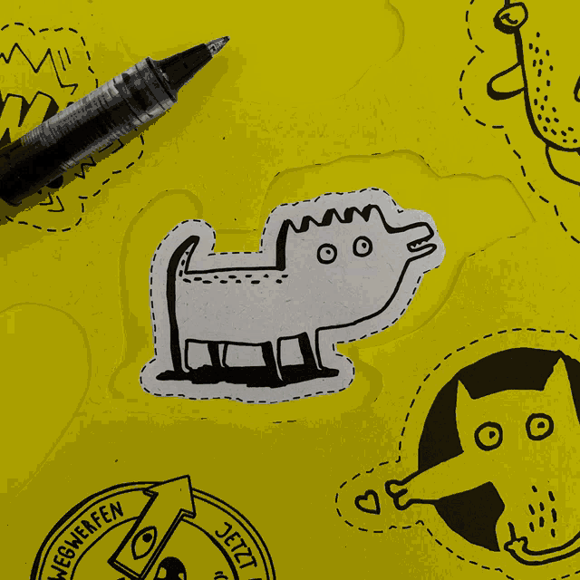 a piece of paper with a drawing of a cat and the words jetzt