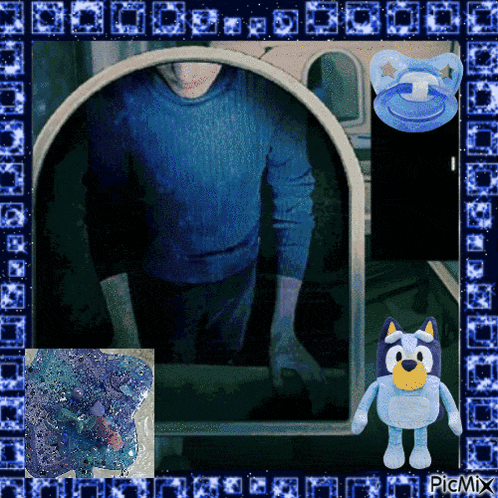 a picture of a man in a blue sweater with a pacifier next to it