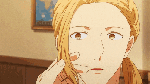 a close up of a person 's face with a ponytail
