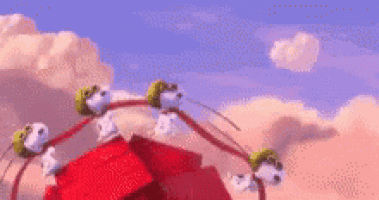 a ferris wheel with a bunch of birds on it is in the sky .