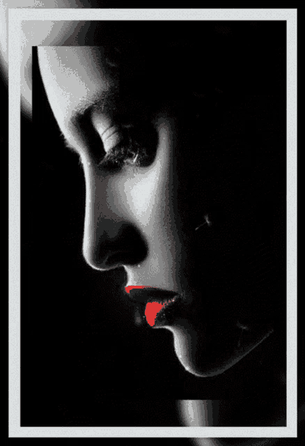a close up of a woman 's face with red lips