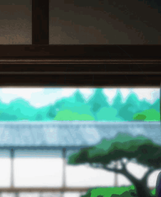 a blurry picture of a house with a tree in the background
