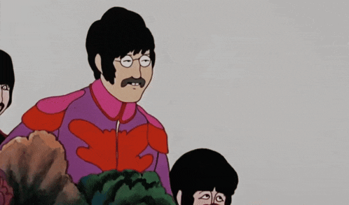a man with glasses and a mustache is pointing