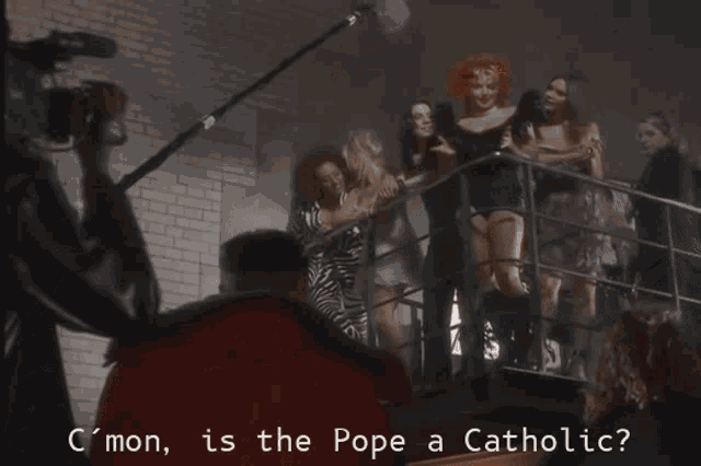 a woman with red hair is asking if the pope is catholic
