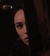 a close up of a woman 's face with her eyes closed