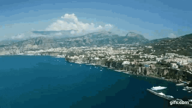an aerial view of a large body of water surrounded by mountains