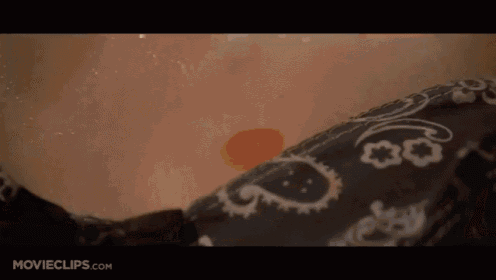 a close up of a woman 's face with a nose ring in a movie scene .