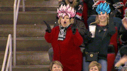 a woman in a red jacket is wearing a hat with a dragon ball character on it