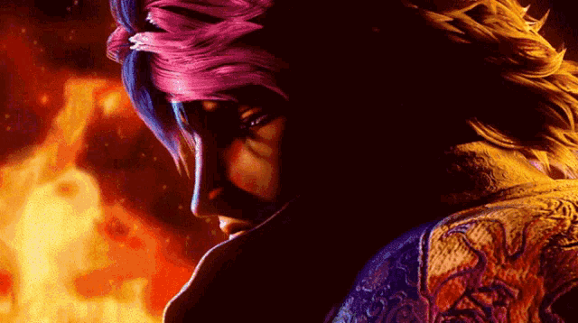 a close up of a person 's face with a fire background