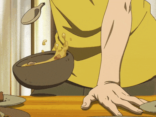 a person in a yellow shirt is pouring a bowl of soup