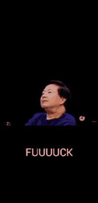 a man in a blue shirt is making a funny face and the words fuuuuck are below him