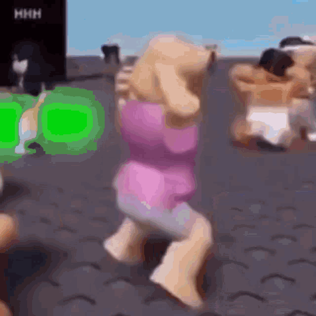 a doll is dancing in a video game with a green screen .