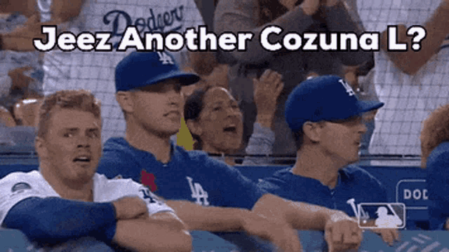 a group of people sitting in a stadium with the words jeez another cozuna l on the bottom