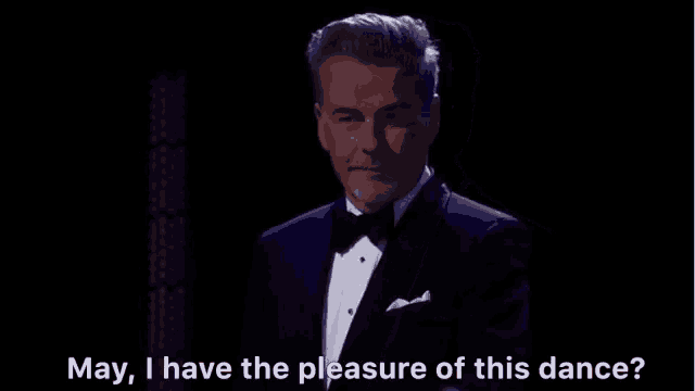 a man in a tuxedo and bow tie is saying may i have the pleasure of this dance ?