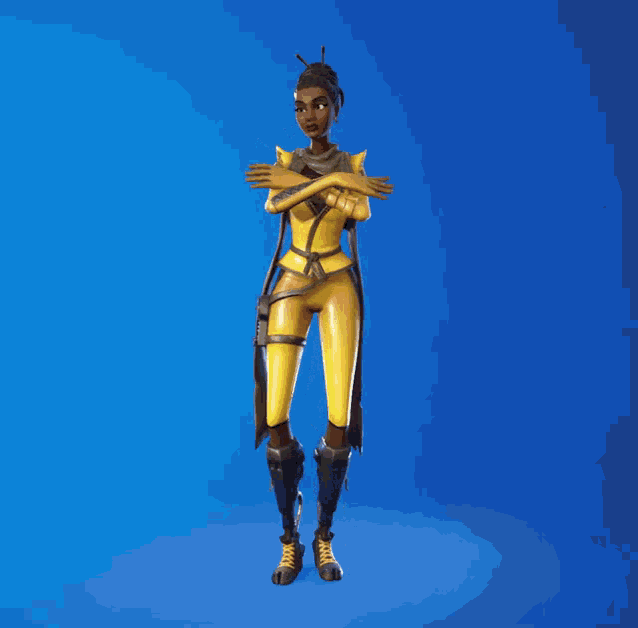 a woman in a yellow outfit with a scarf around her neck stands in front of a blue background