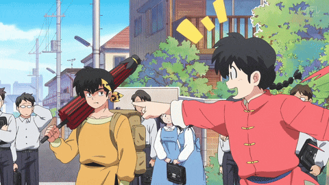 a girl in a red and yellow outfit is pointing at a boy in a yellow shirt