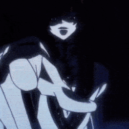 a man and a woman are dancing together in a dark room .