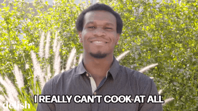 a man says " i really can 't cook at all " in front of trees