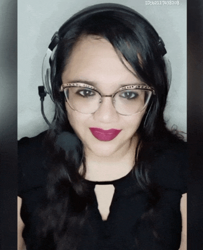 a woman wearing glasses and a headset has the id of id621117433208