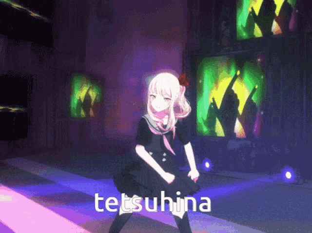 a girl is dancing on a stage and the name tetsushina is visible