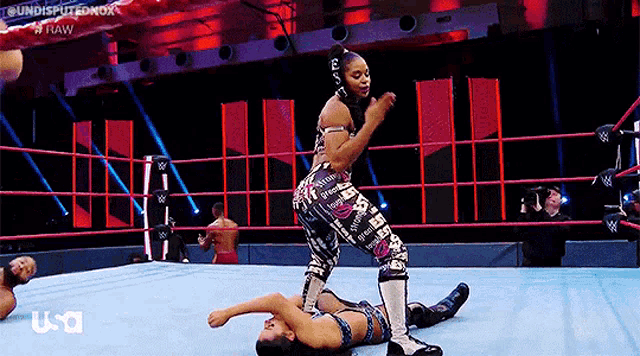 a woman is wrestling another woman in a ring with usa written on the bottom