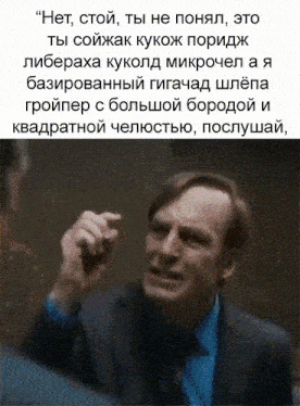 a man in a suit and tie is pointing at another man