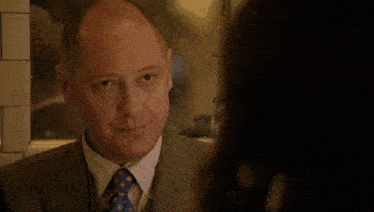 a man in a suit and tie with the words i 'm fascinated behind him