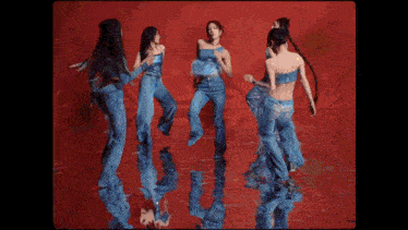 a group of women dancing on a red background
