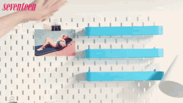 a picture of a woman laying on a raft is on a wall with the words seventeen written on it