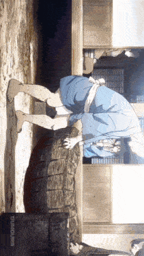 a man in a blue shirt is standing next to a barrel that says dummourr on it