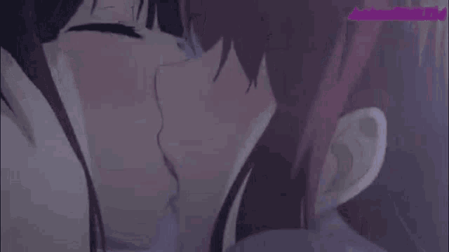 two anime girls are kissing each other in a close up .