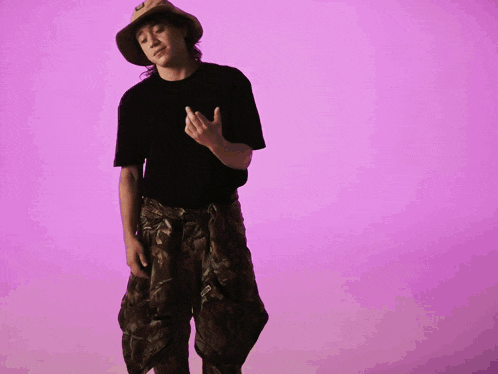 a woman wearing a hat with a black shirt on
