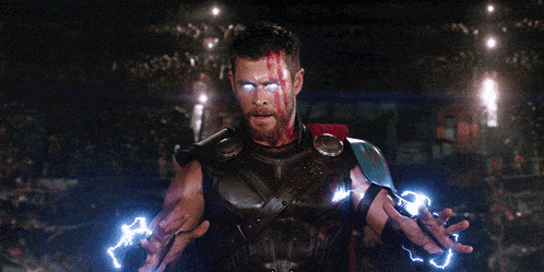 a man in a superhero costume is surrounded by lightning bolts