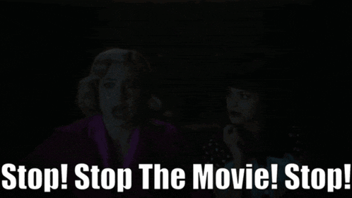 two women in a dark room with the words stop stop the movie