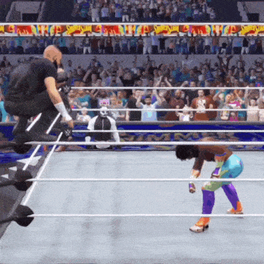 a wrestling match is being played in front of a crowd with a banner that says wwe