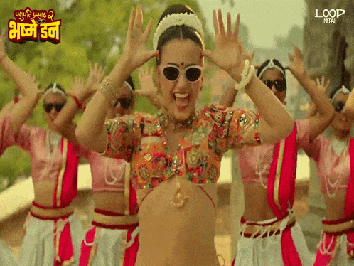 a group of women are dancing in a loop nepal video