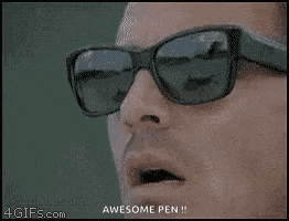 a man wearing sunglasses is holding a pen in his hand .