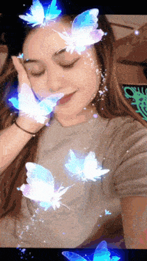 a woman with blue butterflies on her face