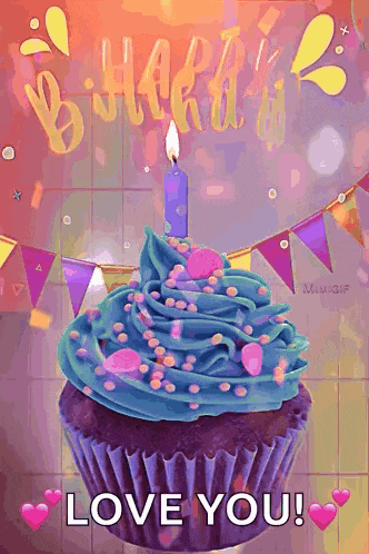 a cupcake with blue frosting and a lit candle on top of it .