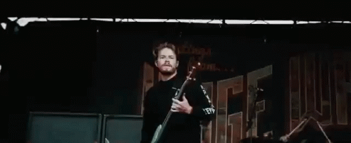 On Guitars Jump GIF - On Guitars Jump Rocking The Stage GIFs