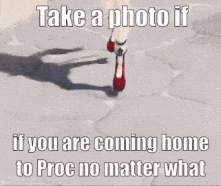 a woman in red shoes is walking down a sidewalk .