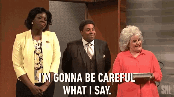 a man and two women are standing next to each other and one of them says i 'm gonna be careful