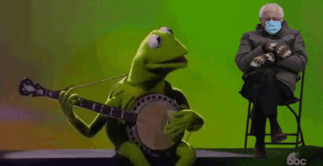 kermit the frog is playing a banjo while bernie sanders sits in a chair