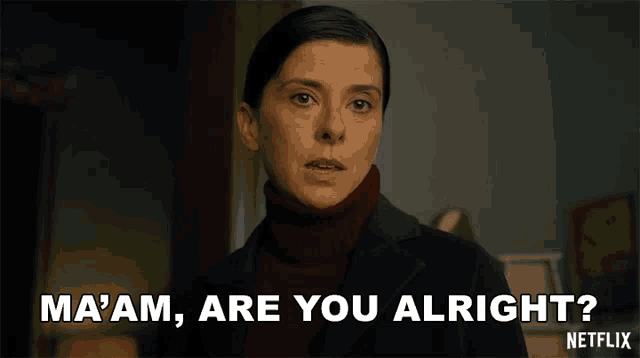 a woman in a black suit and red turtleneck says ma 'am are you alright netflix