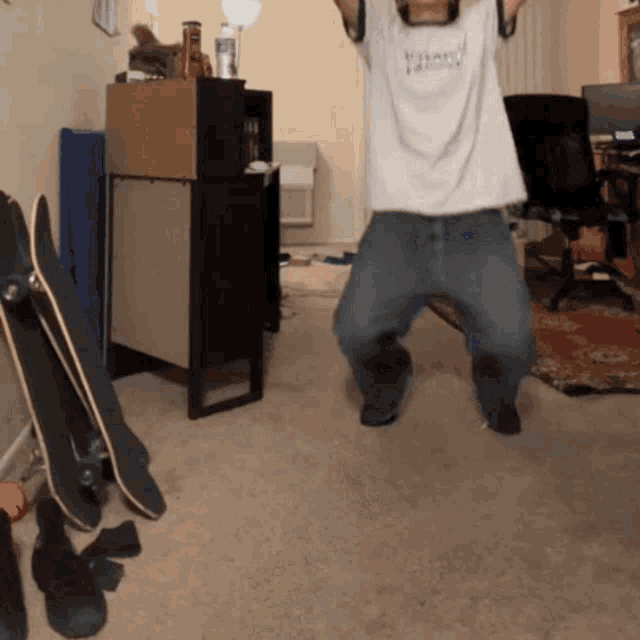 a man wearing a supreme shirt is dancing in a room